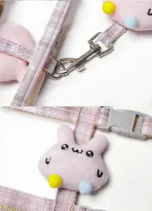 Cute plush rabbit pet harness strap detail, soft fabric, secure metal clip and durable buckle.