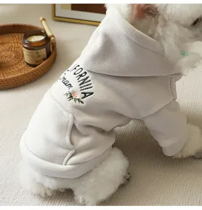 Detailed view of soft grey fleece dog hoodie with back embroidery and cozy winter design.