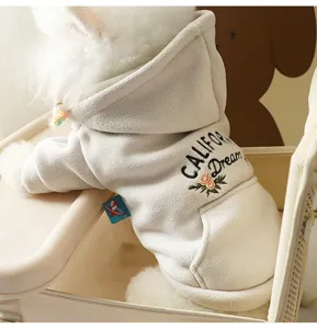 Close-up detail of a soft fleece dog hoodie with cozy hood and stylish back embroidery.