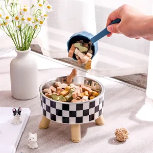 Elevated pet bowl with stainless steel bowl and cute checkerboard design for cats and dogs.