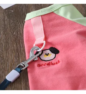 Spring summer thin pet dog clothes cartoon color block apparel close-up detail view.