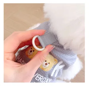 Close-up detail of grey mesh pet dog vest showing D-ring leash attachment and bear print.