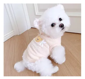 Pink waffle-knit pet vest detail featuring cute bear graphic and letter print for small dogs.