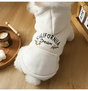 Closeup of cozy pet dog hoodie featuring embroidered California Dream text and warm hood.