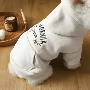 Cute white fleece dog hoodie with embroidery and back pocket, warm winter pet clothes for small dogs.