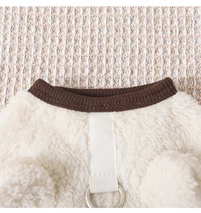 Cozy pet fleece vest detail, warm winter dog clothes with D-ring, soft plush fabric for small dogs.