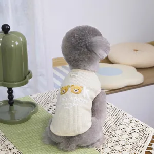 Cute mesh dog vest with bear graphic, breathable summer pet clothing for small dogs.