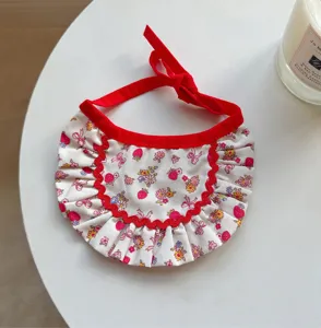 Cute strawberry floral pet cat bib with red ruffles and ribbon ties, sweet kitten neck accessory.