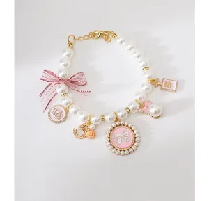 Cute pet pearl necklace with pink bow, crown and perfume bottle pendants for dogs cats