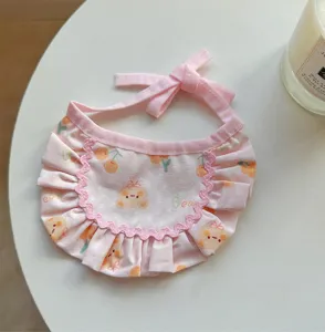 Cute pink pet bib with ruffles and bear print, sweet style cat saliva towel collar accessory.