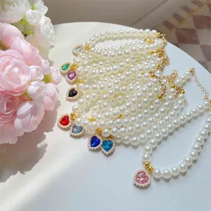 Cute pet pearl necklace with colorful heart crystal pendant, sweet cat collar decor.