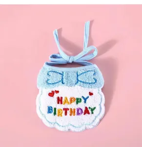 Cute pet birthday bib detail, soft plush material with colorful embroidery and tie straps.