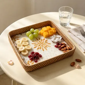 Rattan woven serving tray with shell mosaic and floral pattern, ideal for fruit and snacks.