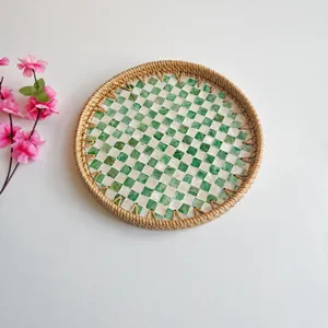 Handmade rattan shell serving tray with green mosaic inlay, perfect for home decor and snacks.