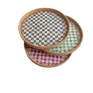 Handmade rattan serving tray with mother of pearl checkered inlay for home decor and snacks.