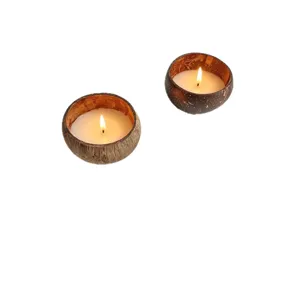 Natural coconut shell scented candle in bowl shape with warm flickering flame for home decor.