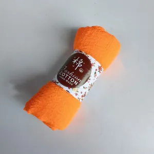 Orange crinkle cotton scarf, natural wrinkled hijab and breathable fashion wrap for women.