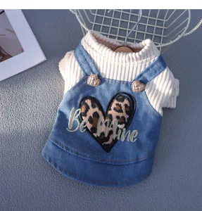 Cute dog autumn sweater with denim strap skirt, leopard heart embroidery detail for small pets.