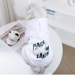 Close-up detail of white cat hoodie with cute peace dove graphic and letters on back view.