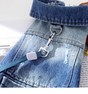 Close-up detail of the gradient blue pet denim jacket featuring a sturdy metal D-ring and leash.
