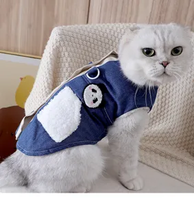 Cute cat denim vest with plush pocket and panda patch, comfortable pet apparel for autumn winter.