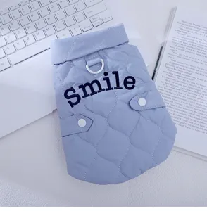 Blue quilted cat vest detail, warm autumn winter pet clothes with traction D-ring and smile text.