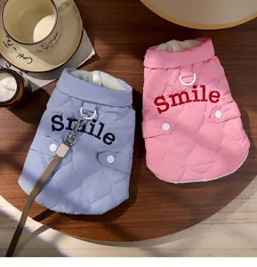 Cute winter warm pet vest for cats and dogs with cute smile embroidery and traction ring design.