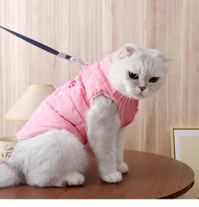 Pink quilted cat vest with leash, warm autumn winter pet apparel, comfortable two-legged clothes.