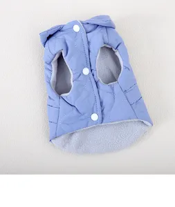 Detailed view of the blue quilted cat vest with warm fleece lining and snap buttons.