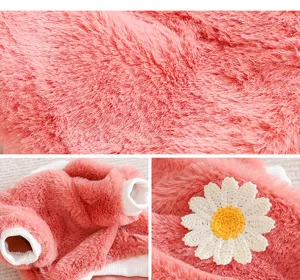 Cute pink pet winter fleece clothing detail close up showing soft plush fabric and daisy flower
