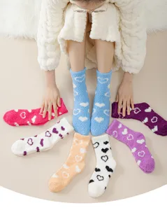 Cozy coral fleece fuzzy socks for women, featuring cute heart patterns for warm winter indoor wear.
