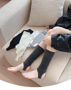 Detail shot of summer thin stirrup leg warmers stacked socks in soft cotton fabric.