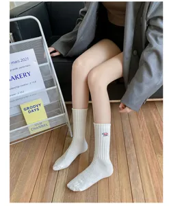 White ribbed cotton mid-tube socks featuring cute bear embroidery, soft breathable daily wear.