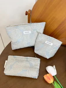 Embossed rose cosmetic bag set, large capacity portable makeup pouch and travel storage organizer.