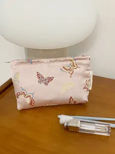 Vintage butterfly pattern cosmetic bag, large capacity travel makeup pouch and portable toiletry organizer.