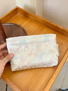Jacquard butterfly cosmetic bag, cute portable makeup pouch for travel storage.
