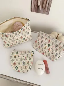 Floral cosmetic pouch detail view, aesthetic canvas makeup organizer bag for daily travel.