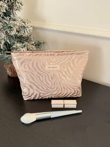 Pink zebra pattern large cosmetic bag portable makeup storage travel pouch with zipper.