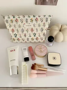 Close-up view of a Japanese fresh floral cosmetic bag displayed with daily skincare essentials.