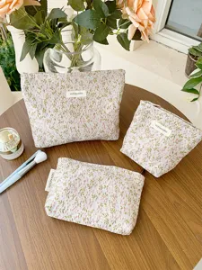 Detailed view of the French floral embroidered canvas cosmetic bag and storage pouch.