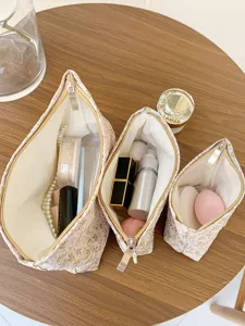 Detailed view of large capacity floral canvas cosmetic bags set, travel makeup organizer pouch.