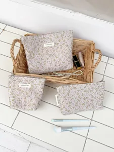 Detailed view of the stylish floral canvas makeup bag, ideal for daily travel cosmetic storage.