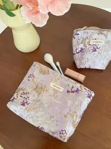 Purple embroidered floral cosmetic bag, large capacity travel storage pouch and portable clutch.