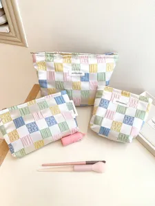 Pastel checkerboard cosmetic bag set, cute embroidered makeup pouch and travel toiletry bag.