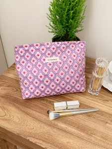 Large capacity purple cosmetic bag with pink floral jacquard pattern and chic design.