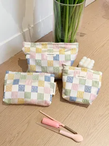 Quilted makeup bag set with trendy plaid pattern, large capacity portable travel toiletry pouch.