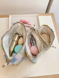 Detailed view of 3-piece patchwork cosmetic bags, large capacity makeup pouch for travel storage.