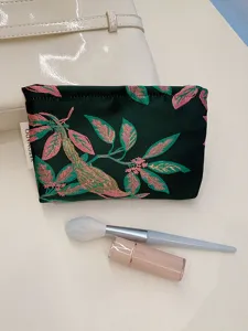 Portable floral cosmetic pouch, durable zippered makeup organizer bag for daily travel.