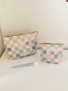 Checkerboard cosmetic makeup bag set, aesthetic travel storage pouch with cute floral pattern.