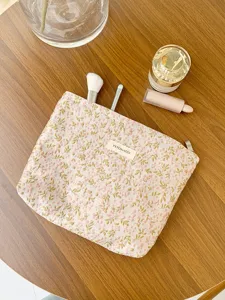 Detail shot of the French floral embroidered canvas makeup bag, large capacity travel storage.